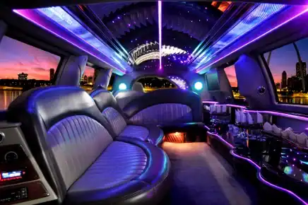 Luxurious interior of FTS Limousine's Black Diamond 8-passenger stretch limousine featuring plush leather seating, fiber optic ceiling lighting, ambient LED accents, premium bar area, and spacious cabin for elegant transportation throughout Gainesville, Jacksonville, Ocala, St. Augustine, and North Florida.