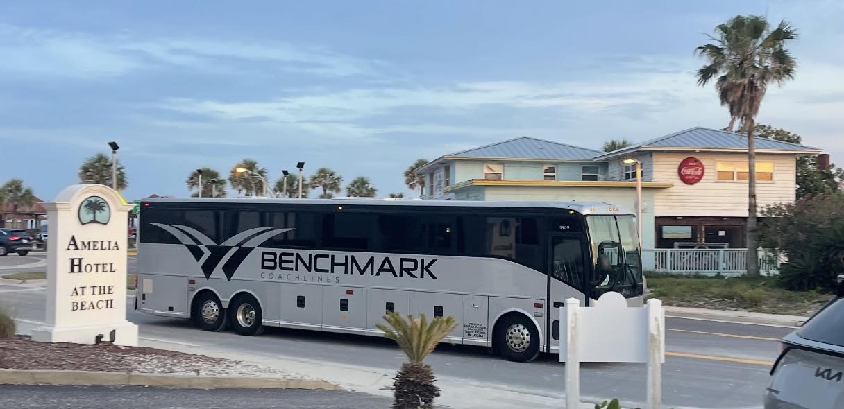 Benchmark Coachlines charter bus transporting wedding guests in Amelia Island Florida – luxury group transportation service