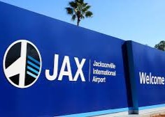 Jacksonville International Airport terminal entrance sign at JAX Airport in Jacksonville Florida.