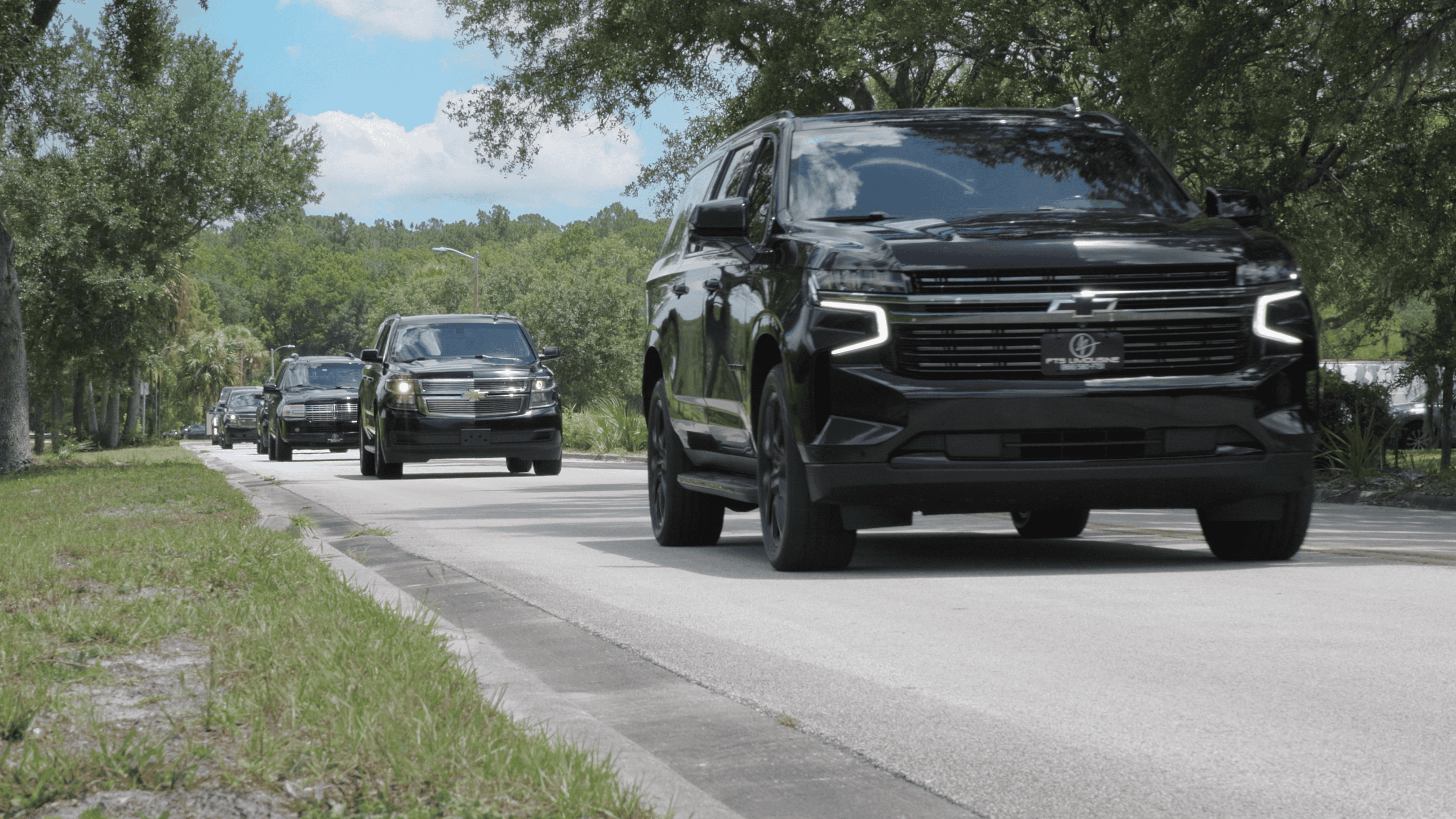 FTS Limousine fleet led by a luxury Chevrolet Suburban followed by executive SUVs providing coordinated VIP and corporate transportation in North Florida.