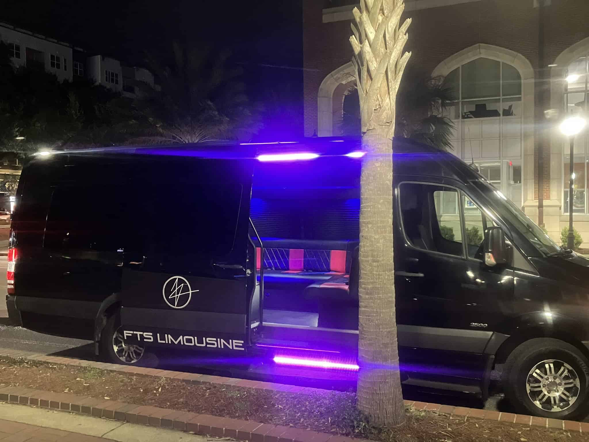 Black Mercedes Sprinter Limousine with led lights and a view inside the limo while parked near palm trees at night during a UF Football game.