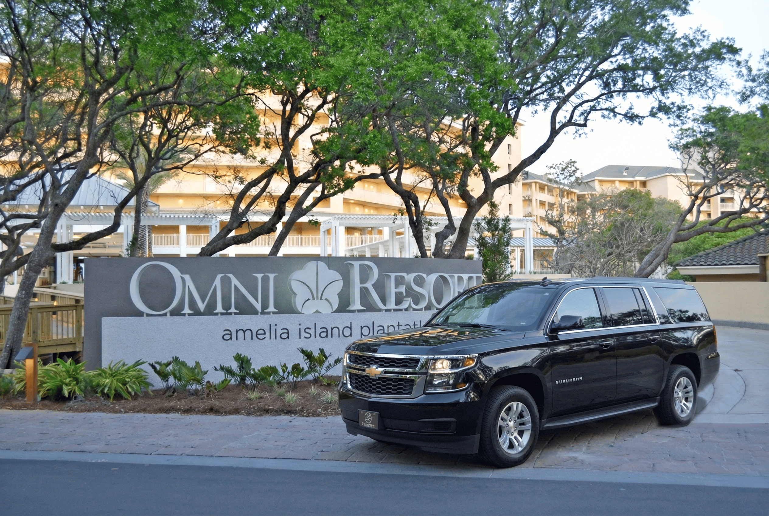 FTS Limousine luxury SUV parked at the entrance to Omni Amelia Island Resort on Amelia Island, Florida, providing premium resort transportation.