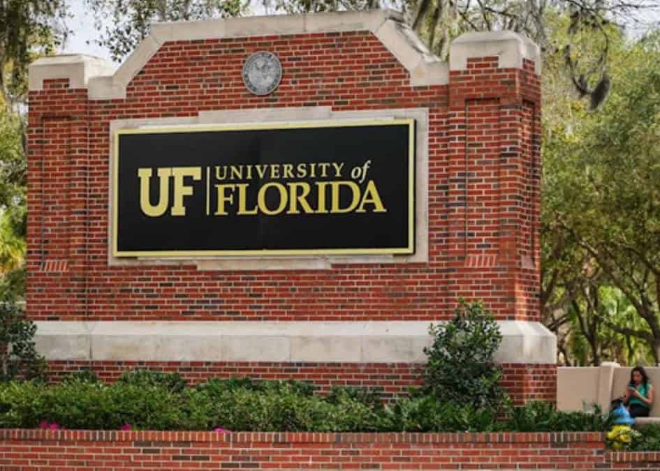 University of Florida brick entrance sign on University Avenue in Gainesville, Florida, welcoming visitors to the UF campus.