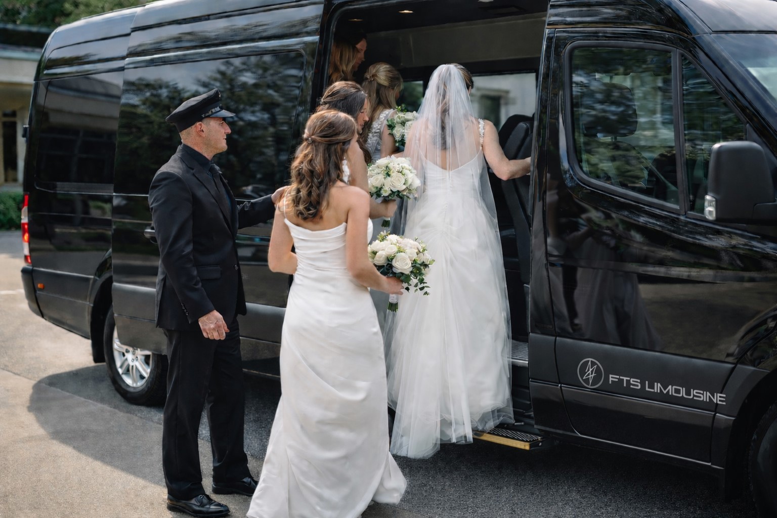 Passengers boarding a luxury Mercedes Sprinter in Gainesville, Florida, with a professional chauffeur assisting.