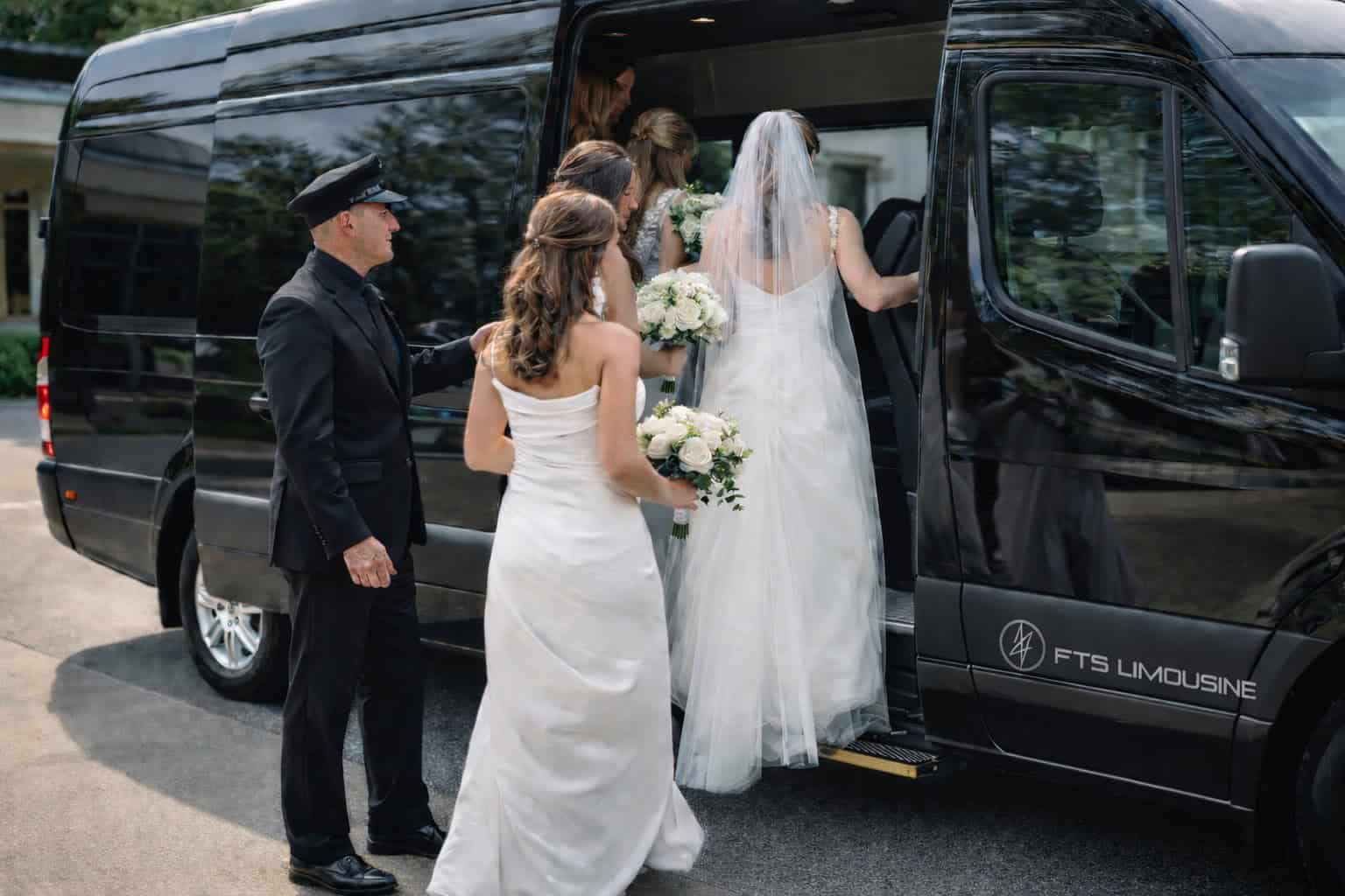 Passengers boarding a luxury Mercedes Sprinter in Gainesville, Florida, with a professional chauffeur assisting.