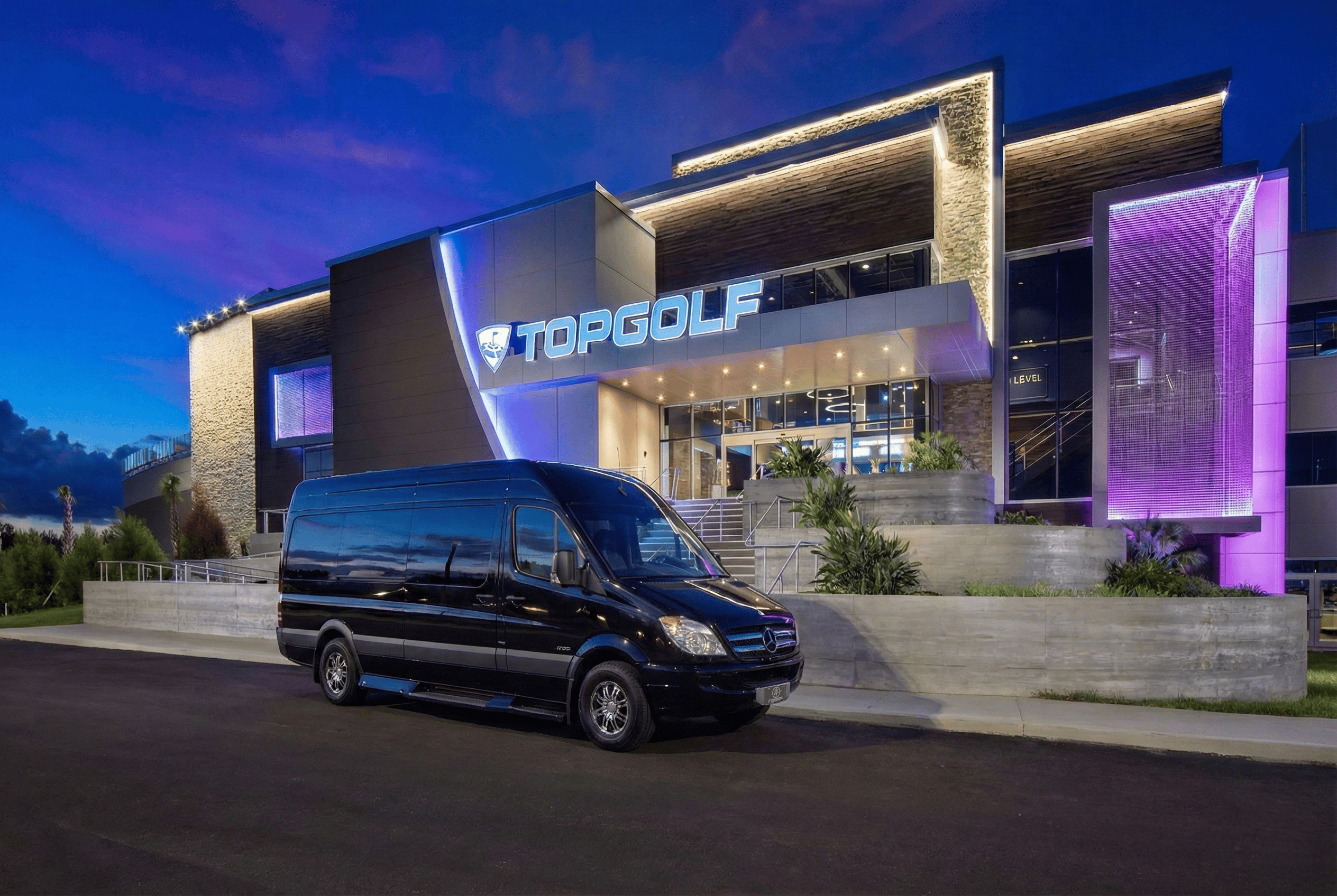 FTS Limousine Mercedes Sprinter parked outside Topgolf Jacksonville providing luxury group transportation.
