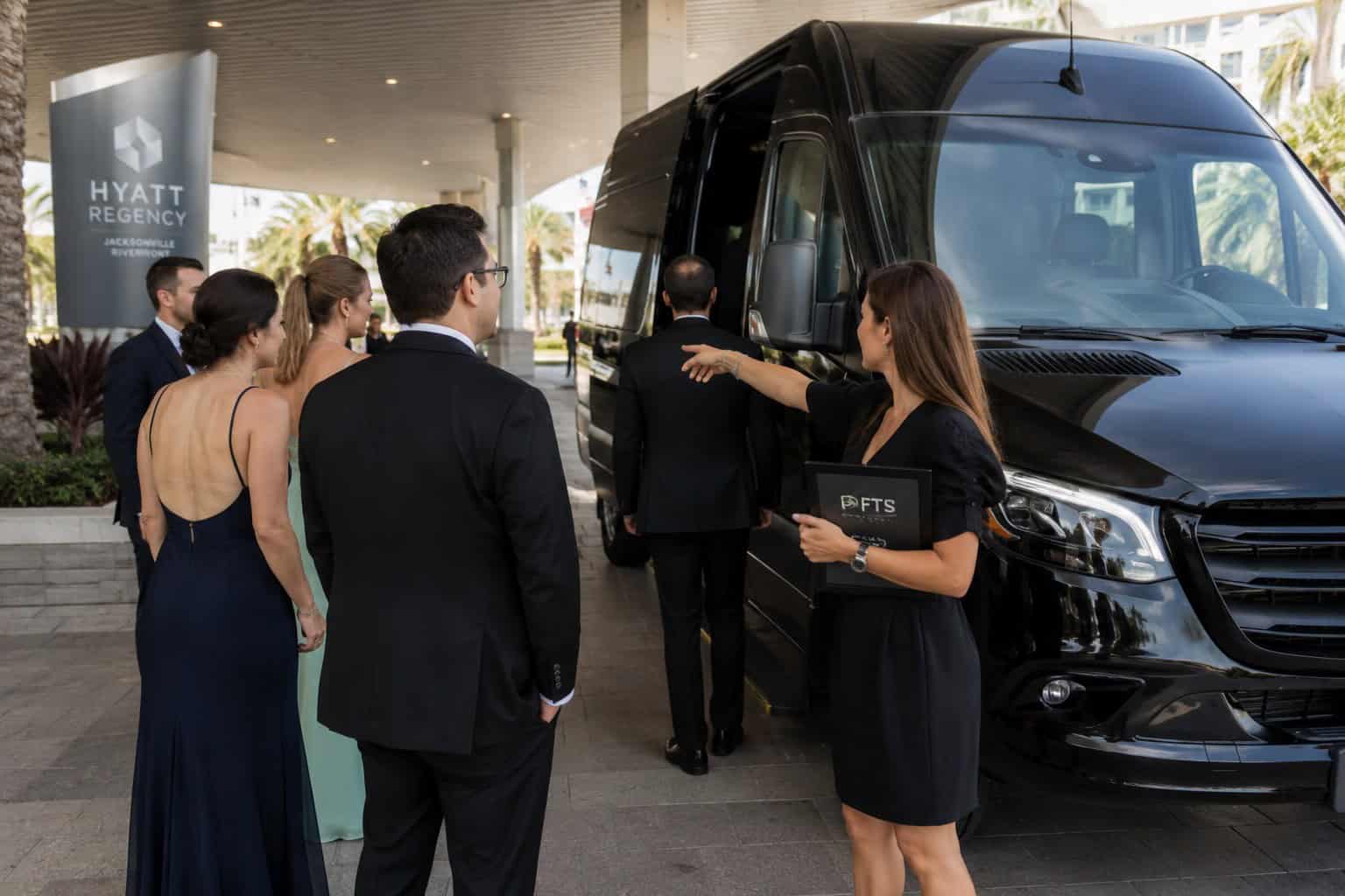 FTS Limousine event coordinator assisting wedding guests as they board a luxury Mercedes Sprinter.