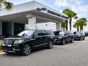 Fleet of FTS Limousine Lincoln Navigator L SUVs staged outside Signature Aviation in Jacksonville, Florida.