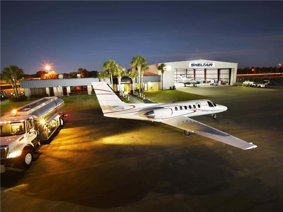 Private jet and fuel truck on the tarmac at Sheltair Aviation in Ocala, Florida.