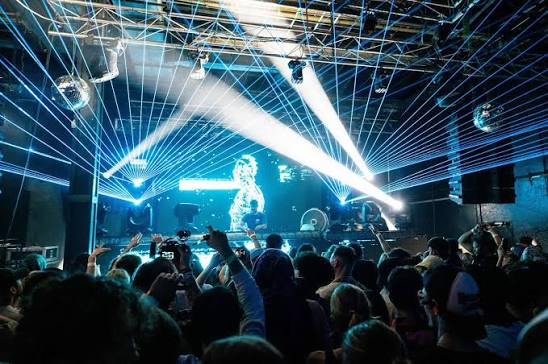 Concert crowd enjoying a live performance at Vivid Music Hall in Gainesville, Florida, with FTS Limousine concert transportation.